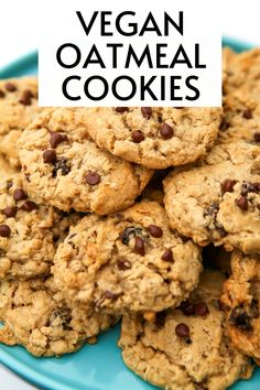 vegan oatmeal cookies stacked on top of each other in a blue plate