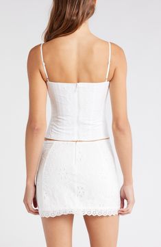 Decorative tonal embroidery adds to the charm of this corset-inspired top made with a hint of stretch for a curve-hugging fit. 12 1/2" length (size Medium) Hidden back-zip closure Square neck Adjustable straps Lined 65% polyester, 32% cotton, 3% elastane Dry clean Imported Fitted Cropped Corset With Corset Back, Fitted White Crop Top With Boned Bodice, Summer Lace Top Fitted Corset, White Lace Top Corset, Fitted Crop Top With Corset Back And Sweetheart Neckline, Fitted Lace Top Corset For Summer, Elegant Fitted Crop Top With Corset Back, Summer Lace Fitted Corset, Elegant Cropped Corset With Fitted Bodice