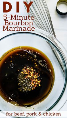 a bowl filled with marinade and spices on top of a table