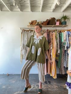 Vintage Green and Yellow Striped Tunic. A head-turning tunic made from a thick green and yellow striped cotton. with white stitched details at the neckline and along the large front pockets. Decal stitched into the back as well. Unique, fun, and easy to wear! Unmarked materials, feels like thick cotton. Unmarked size, fits many due to loose cut. Approx. Measurements: Underarm to underarm: 26" Length: 28" Electric Feathers, Ryan Roche, Christian Wijnants, Ace And Jig, Striped Tunic, Raquel Allegra, Black Crane, Rachel Comey, Green And Yellow