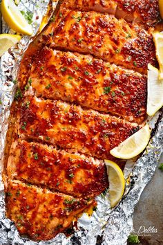 grilled salmon on foil with lemons and parsley