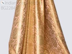 Peach Indian Brocade Fabric Yardage Banarasi Blended Silk Bridal Wedding Dresses Lengha DIY Crafting Sewing Drapery Upholstery Costumes. This is a beautiful heavy benarse art silk brocade floral design fabric in Peach and Gold. ➤Product: Brocade Fabric ➤Fabric Type: Blended Silk (Viscose and Silk) Fine quality Zari Brocade Weaving from Banaras ➤Color: Peach and Gold ➤Width: 44 inches. ➤Condition: New ➤Code: bg2284 ➤Listing for 1 Yard of fabric. ➤Care: Dry Clean Only You can use this fabric to ma Gold Anarkali Dress For Ceremonies, Gold Anarkali Gown For Ceremony, Bollywood Style Gold Gown For Ceremony, Gold Bollywood Gown For Ceremony, Gold Brocade Dress With Traditional Drape, Gold Self Design Wedding Dress, Fitted Gold Gown With Pallu, Gold Lehenga With Pallu For Ceremony, Gold Fitted Lehenga For Ceremony