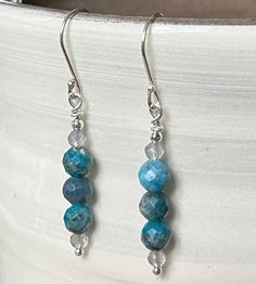 Sparkly blue apatite earrings featuring faceted blue apatite beads, small moonstone beads and sterling silver ear wires. Chip Bead Jewelry, Sundance Style, Moonstone Beads, Blue Apatite, Earrings Dainty, Chip Beads, Dainty Earrings, Bead Jewelry, Style Earrings