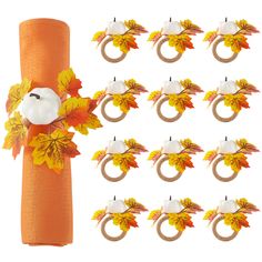 an orange napkin holder with pumpkins and leaves on it