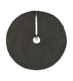 a round black rug with a white circle in the middle on a white background,