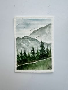 a watercolor painting of mountains and trees with birds flying over them on a white wall