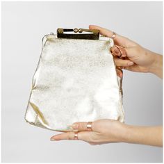 "S T R A I G H T T A L K ▲ Circa: 50s/60s ▲ Label: ▲ Color: Metallic Gold Foil ▲ Condition: Very Good D E T A I L S ▲ Cute vintage metallic platinum gold clutch with optional gold chain shoulder strap ▲ Shoulder chain can fold into the inside of the purse to make it a clutch ▲ Strong kiss lock closure ▲ Satin pink lining ▲ Small interior pocket C O N D I T I O N ▲ Very Good Flaws noted: minor indentations in the gold foil, lining is a little dirty/shows some wear M E A S U R E M E N T S ▲ Width Vintage Evening Bag With Detachable Handle For Party, Vintage Clutch With Gold-tone Hardware, Vintage Clutch With Gold-tone Hardware For Everyday Use, Retro Gold Bag With Detachable Strap, Mid-century Gold Evening Bag, Retro Gold Evening Bag, Vintage Evening Clutch With Detachable Handle, Vintage Clutch With Chain Strap, Vintage Evening Bag With Detachable Strap