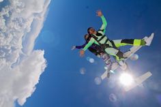 two people in the air on snowboards