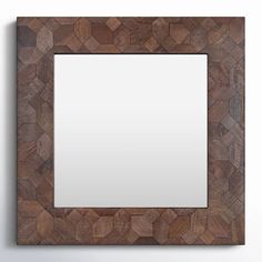 a wooden frame with a mirror on the wall in front of it and a white background