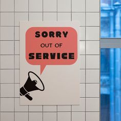 a sign that says sorry out of service with a megaphone in the middle of it