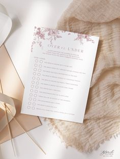 the wedding checklist is sitting on top of a blanket