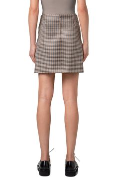 A professorial houndstooth plaid gets its untailored reputation elegantly countered by the polished cut of this skirt flared at the front by box pleats. Hidden back-zip closure 100% virgin wool Dry clean Made in Romania Designer Clothing Formal Fall Tweed Skirt, Formal Tweed Skirt For Fall, Chic Houndstooth Skirt For Work, Plaid Houndstooth Skirt For Fall, Fitted Plaid Mini Skirt For Work, Elegant Houndstooth Mini Skirt, Plaid Pleated Skirt For Work, Elegant Plaid Mini Skirt For Work, Fall Fitted Skirt With Houndstooth Pattern