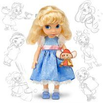 a doll with blonde hair and blue dress holding a teddy bear in her hand on a white background