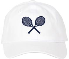 a white hat with two tennis rackets embroidered on it