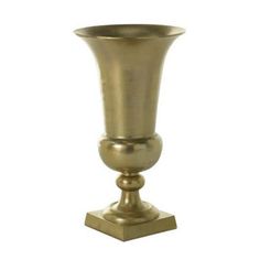 an antique brass vase on a white background