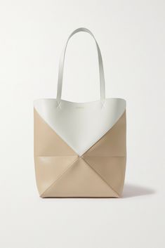 Bags have had a functional update this season - it's all about styles that can be converted so you can get maximum mileage. Loewe's medium 'Puzzle Fold' tote has an origami-like construction that can be folded down when you're storing it or traveling. The two-tone leather is smooth and slouchy and the suede lining is exquisitely soft. Cinderella Fashion, Porter Bag, Loewe Puzzle, Medium Tote Bag, Leather Weekender Bag, Beige Bag, Raffia Bag, Medium Tote, Bagpack