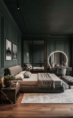 an elegant bedroom with green walls and wood flooring is pictured in this image, there are