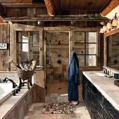 a bathroom with a large tub and wooden walls