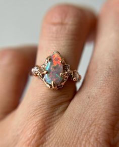 Custom Naples Trio with a stunning semi-dark Freeform Australian opal from @ligas.opals.gems 🤍 #oliviaewing… | Instagram Unique Collectible Opal Ring, Handmade Luxury Opal Ring, Nature-inspired Opal Ring As Gift, Handmade Mystical Opal Ring, Mystical Opal Gemstone Rings, Acotar Feyre, Freeform Ring, Raw Opal Ring, Opal Ring Gold