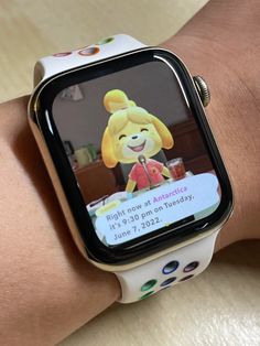 an apple watch with a cartoon character on the screen