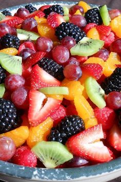 a bowl filled with lots of different types of fruit