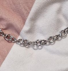 "\"Introducing our handcrafted sterling silver chainlink style chain, a timeless accessory that exudes sophistication and style. Crafted with care using 2mm sterling chain wire, this chain boasts a substantial 10mm thickness, adorned with an 18mm lobster clasp for secure fastening. Weighing a luxurious 94g and measuring 27 inches in length, it is designed to make a statement wherever you go. This sterling silver chain is not just a piece of jewelry; it's a symbol of quality and elegance. Its ver Silver Rectangular Link Rolo Chain Jewelry, White Gold Chunky Chain Link Bracelet, White Gold Link Chain Bracelet With Chunky Chain, White Gold Chunky Link Chain Bracelet, White Gold Cable Chain Bracelet, Sterling Silver Chunky Chain Necklace, Silver Oval Link Chain Bracelet With Cable Detail, Silver Sterling Chunky Chain Necklace, Silver Cable Chain Bracelet With Oval Links