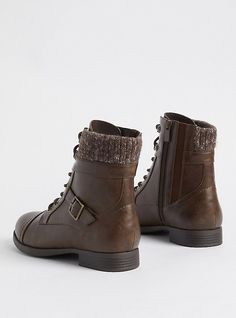 a pair of brown boots with laces and buckles