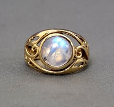 "Handmade item Product :- ring Material :- brass, sterling silver  💎 The gemstone is the MOONSTONE. ✦ Moonstone is a stone that brings hope, enhances feminine energies, sensitivity, intuition, and psychic abilities. It is also said to bring strong energies of abundance to one's life.Moonstone is a stone of protection, especially during childbirth, pregnancy, and travel at sea. It is a stone of calm and relief from emotional stress. Moonstone is birthstone of June. 💎 The natural gemstone can va Handmade Gold Celestial Moonstone Ring, Gold Celestial Moonstone Ring In Sterling Silver, Yellow Gold Brass Moonstone Ring For Gift, Handmade Gold Moonstone Ring In Sterling Silver, Handmade Yellow Gold Moonstone Ring In Sterling Silver, Mystical Gold Moonstone Ring, Gold Mystical Moonstone Ring, Unique Yellow Gold Moonstone Ring, Gold Moonstone Ring With Moon Phase