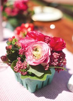 a vase filled with flowers sitting on top of a table