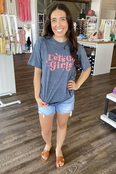 Our 'Let's Go Girls' top isn't just a piece of clothing- it's a statement! Made for the go-getter, it embodies girl power and a zest for life. It's not just about fashion, it's about feeling empowered and embracing who you are. This top will make you stand out from the crowd, turning heads and sparking conversations. Join the movement, wear your confidence! Girls Top, Cut Offs, Cold Drink, You Know It, Girl Top