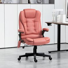 a pink office chair sitting in front of a desk