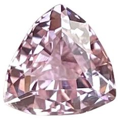 a pink diamond is shown against a white background