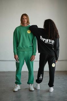 Designed to inspire your inner bravery, our OG graphic sweatpants have two side pockets, an interior adjustable drawstring, and a relaxed fit. GRAPHICS Front: 'Brave the Label' logo puff paint graphic Back: 'Smiley Face' graphic Back: 'We Are' puff paint graphic - "We are Resilient, Fearless, Daring, Day Dreamers, Reform Seekers, Human Beings. Brave the Label". COLORWAYSAvailable in Jet Black + Lucky Green MATERIALSOur sweatpants are made from 100% premium cotton. Made in Los Angeles from a soft Sweatpants Outfit Photoshoot, Sweatpants Design Ideas, Fashion Product Photography Clothing, Boxer Photoshoot, Clothing Line Photoshoot Ideas, Designer Brand Photoshoot, Hoodie Photoshoot Ideas, Clothing Brand Shoot Ideas, Merch Photoshoot Ideas