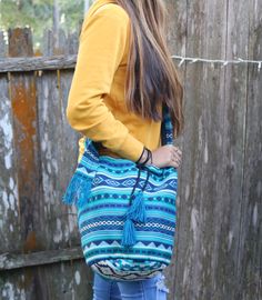 "Gorgeous Handmade Tassel Bag with Tassel Drawstring and Cross-body Strap. We design our Shoulder and Cross-body bags to be beautiful, ergonomic, functional, and durable. A resilient bag to carry your belongings to the gym, yoga studio, beach, camping, traveling, office, shopping, and all your daily activities. - 100% Handcrafted - Handmade products may vary slightly in design - Roomy Interior - Lightweight 1 lb. - Tribal Patterns - Durable Approx sizes: Bag: 7\" wide x 9\" height Length of stra Shoulder Yoga, Bag With Tassel, Ponte Vedra Beach, Boho Handmade, Blue Tassel, Beach Camping, Tassel Bag, Gym Yoga, Different Outfits