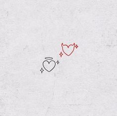 two hearts drawn on the side of a white wall next to an arrow and heart