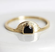 Bohemian engagement ring, a half moon black onyx sunrise ring. A perfect dainty & unique boho inspired ring for a special bride. Select gemstone option from drop down menu. White diamond option comes with 0.16 - 0.17ct half moon diamond ★Details Gemstone: half moon spinel 6x4mm Setting: bezel Band measurements: approx. 1.8mm Material: 14k solid yellow, white or rose solid gold (If you would prefer 18k gold or platinum, please contact us before purchase.) Sizes available: 2-8 (Larger and smal Bohemian Engagement Ring, Sunset Ring, Half Moon Diamond, Gold Sunset, Black Spinel Ring, White Sapphire Engagement Ring, Moon Black, Spinel Ring, Gold Gemstone Ring