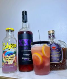 various alcoholic drinks are lined up on the counter