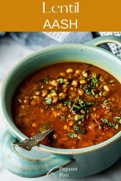 a blue bowl filled with beans and herbs