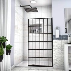 a bathroom with tiled floors and white walls