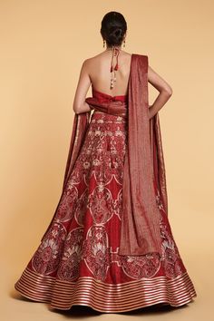 Red and gold 14 kali lehenga with thread jaal, floral thread and crystal window pattern embroidery with aari and crystal border. Comes with stripe work blouse with crystal highlights and dangler tassels belt, thread work dupatta and a net dupatta with stripe work.
Component: 5
Pattern: Embroidered
Type Of Work: Floral Jaal Pattern, Crystals, Aari, Thread Work
Neckline: Plunged V-Neck
Sleeve Type: Sleeveless
Fabric: Lehenga, Blouse, Belt; Dupion Silk; Dupatta 1: Net; Dupatta 2: Tinsil Georgette
C Red Anarkali Pre-draped Saree With Intricate Embroidery, Designer Red Pre-draped Saree With Intricate Embroidery, Red Pre-draped Saree With Intricate Embroidery For Festive Occasions, Festive Red Gown With Zari Work, Festive Red Pre-draped Saree With Intricate Embroidery, Red Fitted Pre-draped Saree With Intricate Embroidery, Red Raw Silk Gown For Navratri, Red Wedding Saree With Intricate Embroidery, Red Wedding Pre-draped Saree With Intricate Embroidery