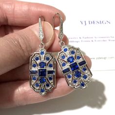 "A pair of something blue Gatsby wedding 1920s vintage style Art Deco bridal earrings with geometric details. These stunning, lightweight earrings are made of sparkly cubic zirconia with white gold silver rhodium plated hooks. Earrings are about 1 3/4\" (4.5cm) with hooks. View matching pieces or similar designs at https://etsy.me/2Mu6wjC See all geometric designs at https://etsy.me/2eKf6s8 View all something blue designs at https://etsy.me/1aLVWtA" Blue Art Deco Wedding Earrings, Blue Art Deco Drop Earrings, Silver Art Deco Bridal Earrings For Party, Sapphire Art Deco Wedding Jewelry, Sapphire Art Deco Jewelry For Wedding, Vintage Bridal Earrings With Elegant Design, Blue Art Deco Jewelry For Wedding, Blue Victorian Earrings For Wedding, Victorian Blue Earrings For Weddings