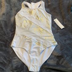 Nicole Miller New York One Piece Swimsuit Nwt Size 8 White With Gold Shimmer White Sleeveless Leotard For Beach, White Sleeveless Leotard For The Beach, White One-piece Swimming Leotard, White Sleeveless Fitted Leotard, White Fitted Sleeveless Leotard, White Stretch Dancewear Bodysuit, White Stretch One-piece Leotard, Stretch White Dancewear Bodysuit, White Fitted Dancewear Bodysuit