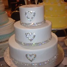 three tiered wedding cake with hearts on top