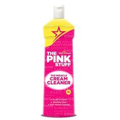 a bottle of pink stuff on a white background