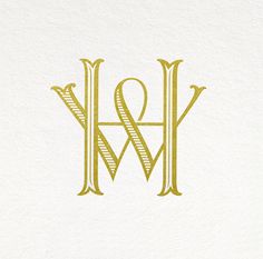 the letter m and w is made up of two letters, one in gold on white paper