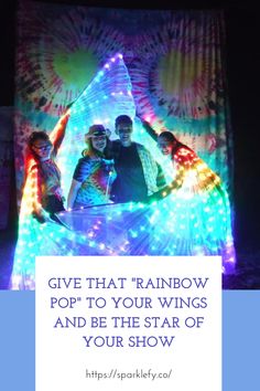 three people standing in front of a colorful light display with the words give that rainbow pop to your wings and be the star of your show