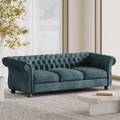 a blue couch sitting on top of a carpeted floor