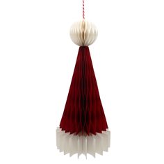 an origami christmas tree decoration hanging from a red and white ribbon with a candy cane