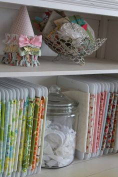 an image of a book shelf filled with paper and crafting supplies on top of each other