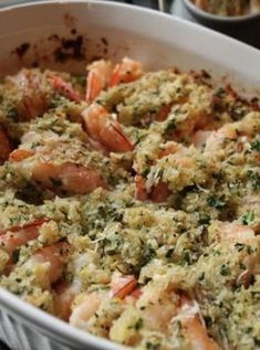 a casserole dish filled with shrimp and cheese